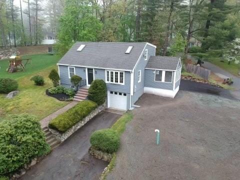 view of front of home featuring an attached garage and aphalt driveway
