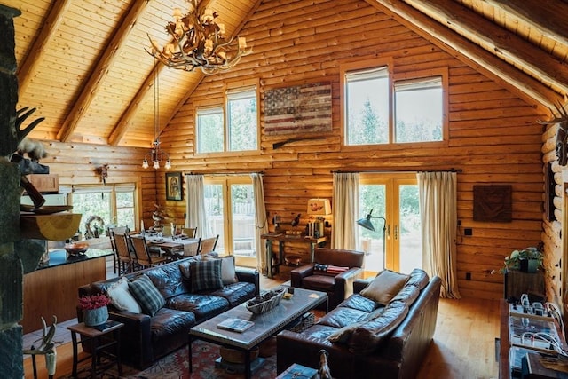 15 Stephanie Ln, Peru, MA 01235 - living room with high vaulted ceiling, a chandelier, french doors, wood ceiling with exposed beams, and hardwood / wood-style floors