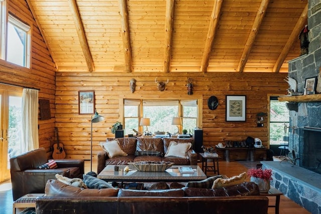 15 Stephanie Ln, Peru, MA 01235 - living room with high vaulted ceiling, wood ceiling with exposed beams, wood finished floors, log walls, and plenty of natural light