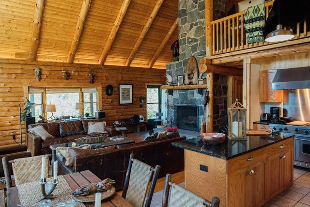 15 Stephanie Ln, Peru, MA 01235 - kitchen with high end stove, high vaulted ceiling, range hood, log walls, and wood ceiling with exposed beams