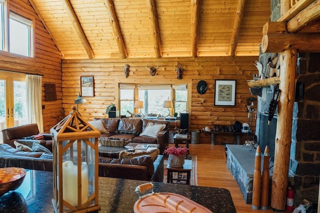 15 Stephanie Ln, Peru, MA 01235 - living room featuring wood ceiling with exposed beams, wood finished floors, healthy amount of natural light, log walls, and high vaulted ceiling