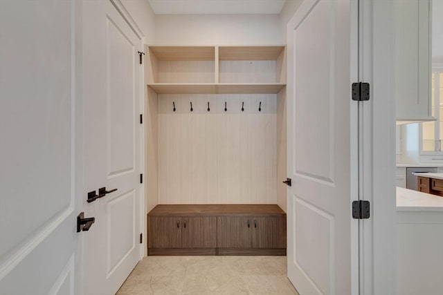 empty room with ornamental molding and light hardwood / wood-style flooring