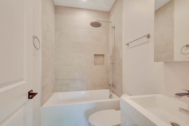 full bathroom featuring vanity, toilet, and tiled shower / bath