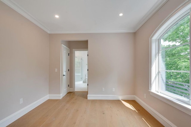 spare room with light hardwood / wood-style flooring and ornamental molding