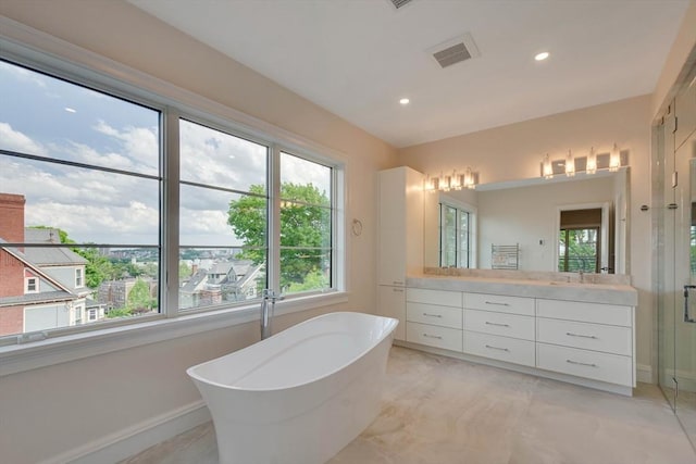 bathroom with vanity and a shower with door