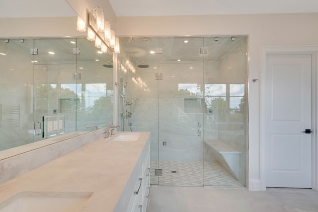 bathroom featuring vanity and an enclosed shower