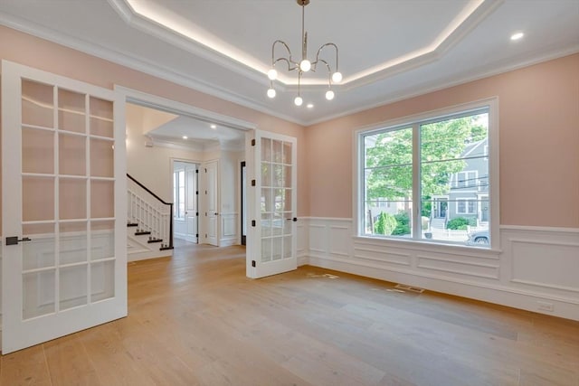 bar featuring light stone countertops, crown molding, sink, white cabinets, and light hardwood / wood-style floors