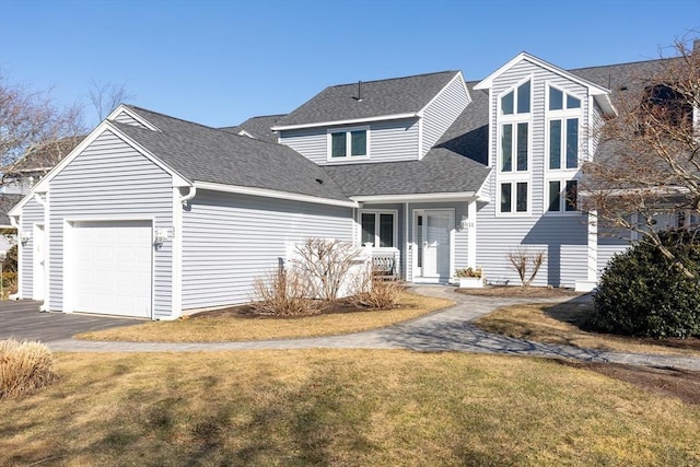 11 Fairway Dr Unit Oceanview, Plymouth, MA 02360 - view of front facade with roof with shingles, a front lawn, aphalt driveway, and an attached garage