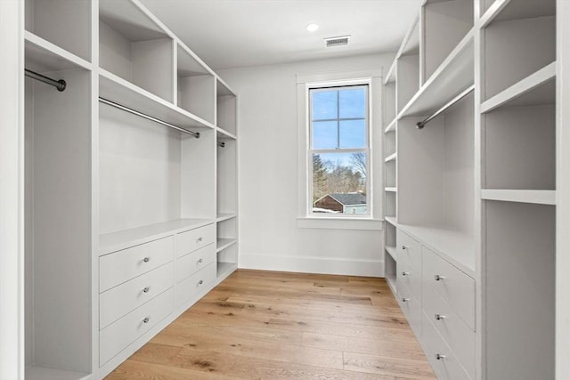 spacious closet featuring light wood-style floors and visible vents