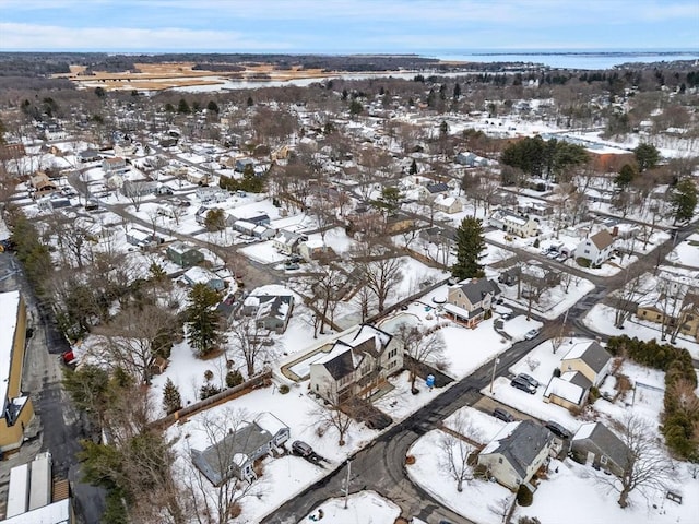 snowy aerial view with a residential view