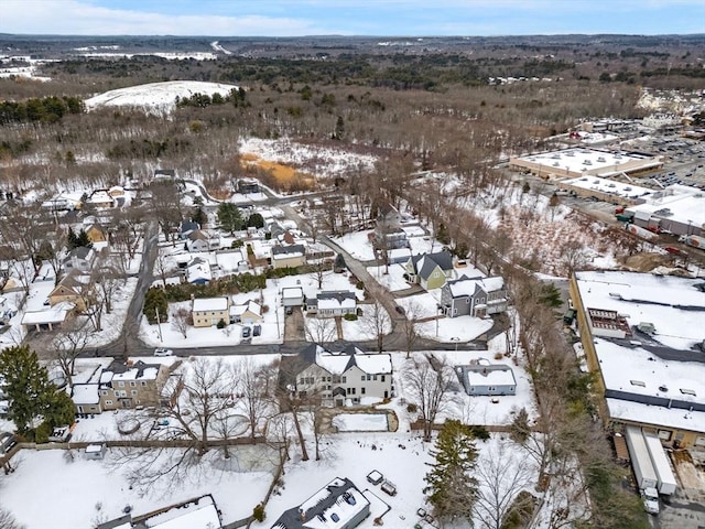 snowy aerial view with a residential view