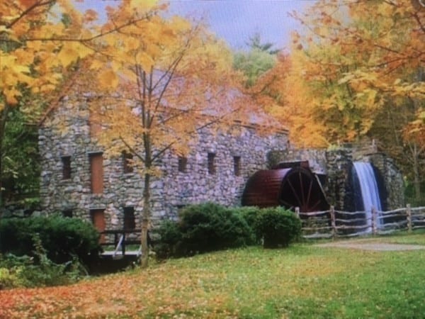 view of side of property with a lawn