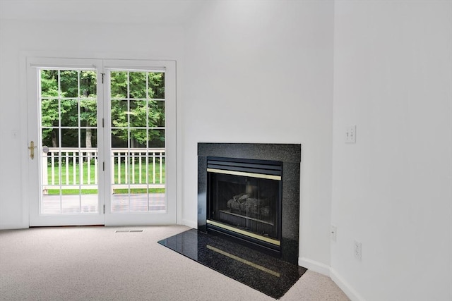 84 Pine Grove Dr Unit 84, South Hadley, MA 01075 - detailed view of carpet flooring and a glass covered fireplace