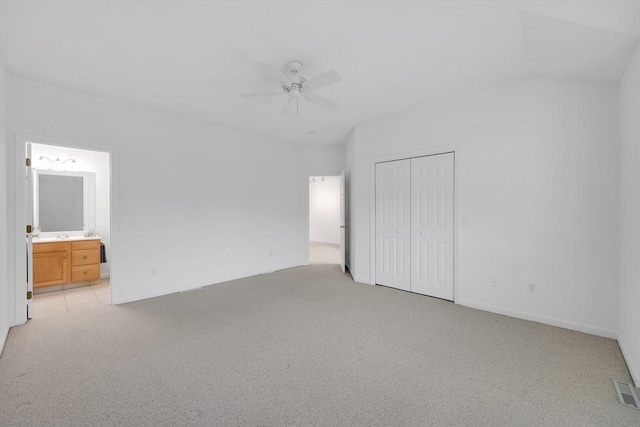 84 Pine Grove Dr Unit 84, South Hadley, MA 01075 - unfurnished bedroom featuring light carpet, a closet, ensuite bathroom, and ceiling fan