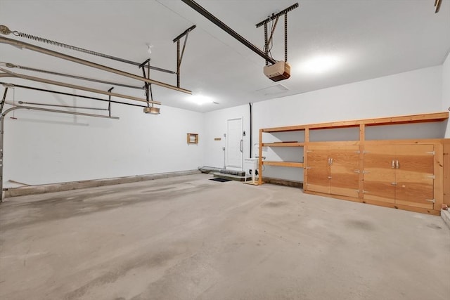 84 Pine Grove Dr Unit 84, South Hadley, MA 01075 - garage featuring a garage door opener