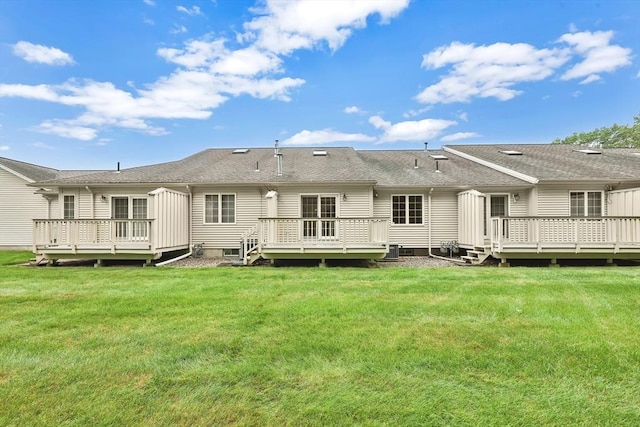 84 Pine Grove Dr Unit 84, South Hadley, MA 01075 - back of property featuring a deck and a lawn