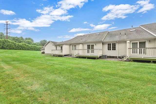 84 Pine Grove Dr Unit 84, South Hadley, MA 01075 - back of property featuring a deck, a yard, and a shingled roof