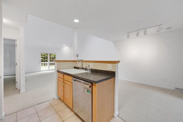 84 Pine Grove Dr Unit 84, South Hadley, MA 01075 - kitchen with stainless steel dishwasher, light colored carpet, dark countertops, decorative backsplash, and rail lighting