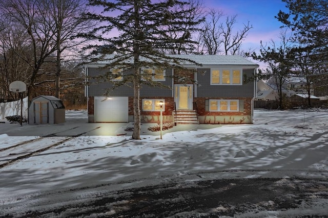 raised ranch with a garage and a storage unit