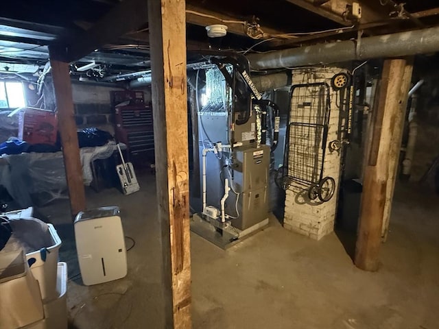 below grade area featuring heating unit