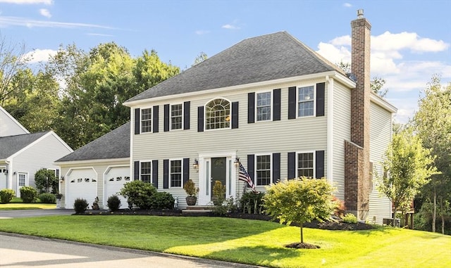 14 Harbor Light Rd, Leominster, MA 01453 - colonial inspired home with a chimney, a garage, a front yard, driveway, and a shingled roof