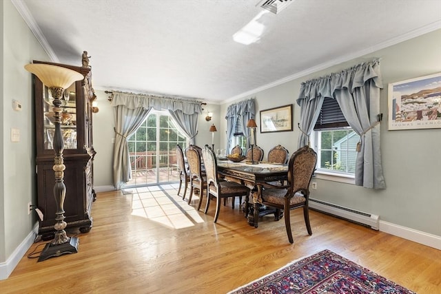 14 Harbor Light Rd, Leominster, MA 01453 - dining area with wood finished floors, ornamental molding, and a baseboard radiator