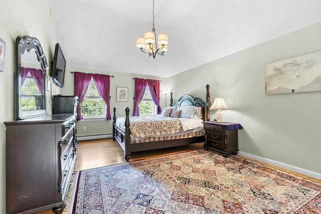 14 Harbor Light Rd, Leominster, MA 01453 - bedroom featuring a chandelier, a baseboard radiator, and wood finished floors