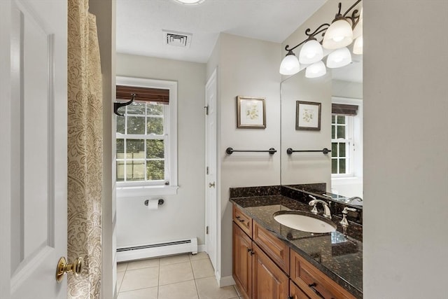 14 Harbor Light Rd, Leominster, MA 01453 - bathroom with baseboard heating, vanity, and tile patterned flooring
