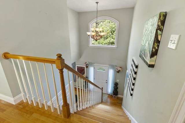 14 Harbor Light Rd, Leominster, MA 01453 - stairs featuring wood finished floors and a chandelier