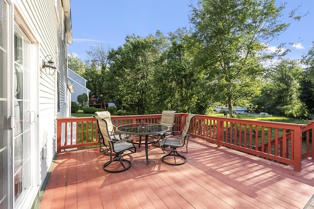 14 Harbor Light Rd, Leominster, MA 01453 - wooden terrace with outdoor dining space and view of scattered trees