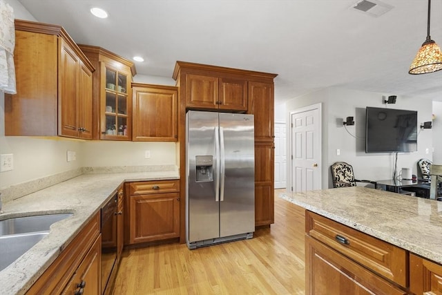 14 Harbor Light Rd, Leominster, MA 01453 - kitchen featuring stainless steel fridge with ice dispenser, light wood-style flooring, brown cabinetry, and recessed lighting