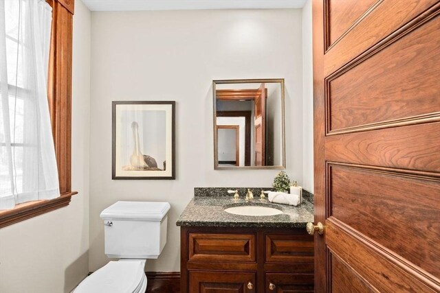 half bath with toilet and vanity