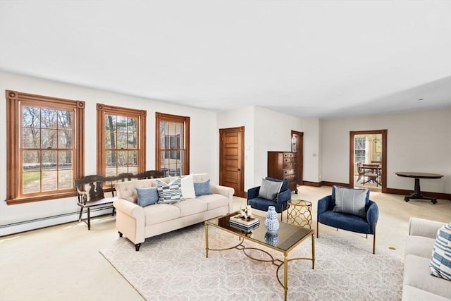 living area with carpet floors, baseboards, and a baseboard radiator