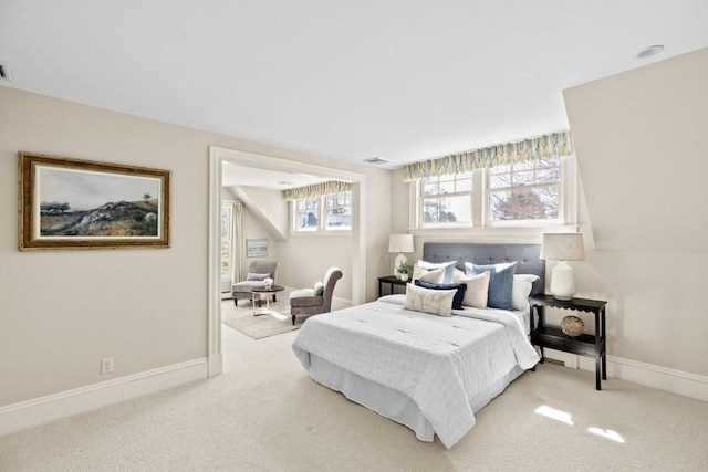 bedroom with carpet, visible vents, and baseboards