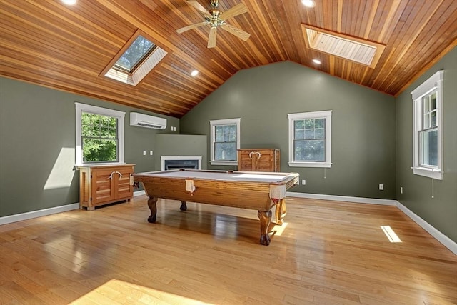 299 Reedy Meadow Rd, Groton, MA 01450 - playroom with a skylight, a fireplace, wooden ceiling, a wall mounted air conditioner, and vaulted ceiling