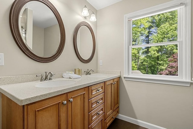 299 Reedy Meadow Rd, Groton, MA 01450 - bathroom with double vanity and baseboards