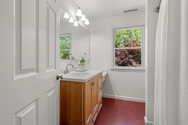 299 Reedy Meadow Rd, Groton, MA 01450 - full bathroom with vanity, plenty of natural light, and baseboards