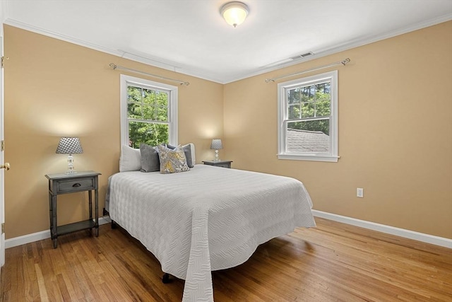 299 Reedy Meadow Rd, Groton, MA 01450 - bedroom with baseboards, wood finished floors, multiple windows, and ornamental molding