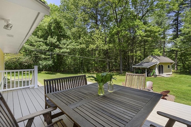 299 Reedy Meadow Rd, Groton, MA 01450 - wooden deck featuring outdoor dining area, a lawn, and view of scattered trees