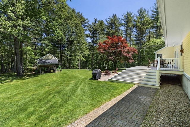 299 Reedy Meadow Rd, Groton, MA 01450 - view of green lawn with a wooden deck and view of scattered trees