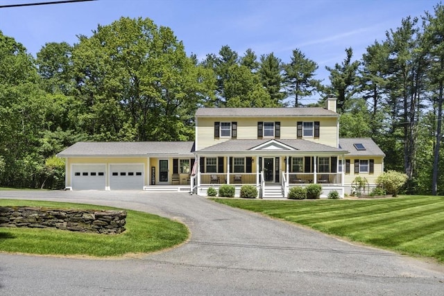 299 Reedy Meadow Rd, Groton, MA 01450 - colonial inspired home featuring a chimney, covered porch, driveway, an attached garage, and a front yard