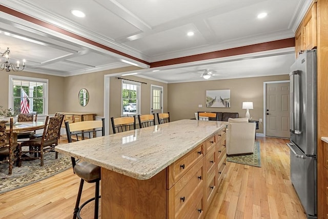 299 Reedy Meadow Rd, Groton, MA 01450 - kitchen featuring freestanding refrigerator, a kitchen breakfast bar, coffered ceiling, light wood-type flooring, and ornamental molding