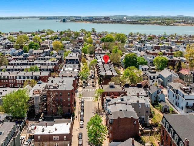aerial perspective of suburban area featuring a large body of water