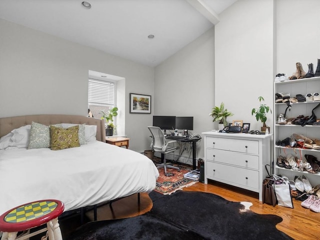 289 K St, Boston, MA 02127 - bedroom featuring wood finished floors, vaulted ceiling, and a desk