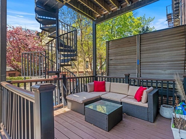 wooden terrace featuring stairs and an outdoor living space