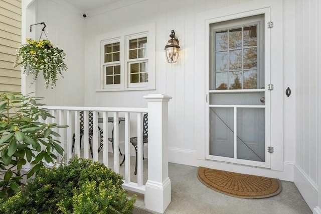 view of exterior entry with a porch