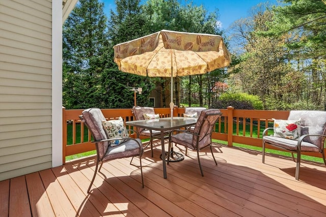 wooden deck with outdoor dining area
