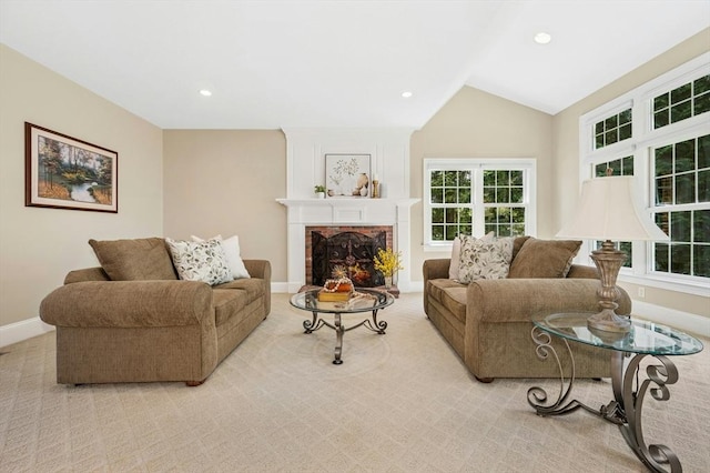 living room with carpet floors, a brick fireplace, baseboards, recessed lighting, and vaulted ceiling