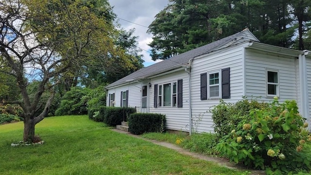 view of property exterior featuring a yard