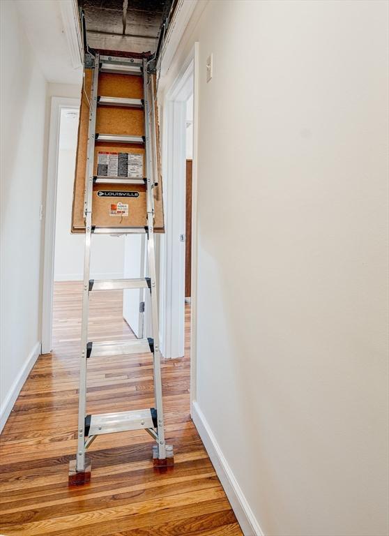 interior space with light wood-type flooring and baseboards